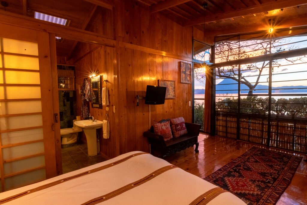 Villa Jade bedroom with lake view and volcano at sunset