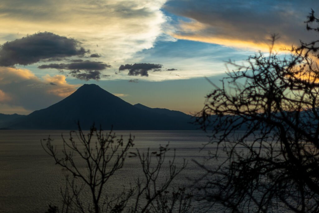 Volcano silhouette at sunset over Lake Atitlan, Guatemala, near Villas Balam Ya.
