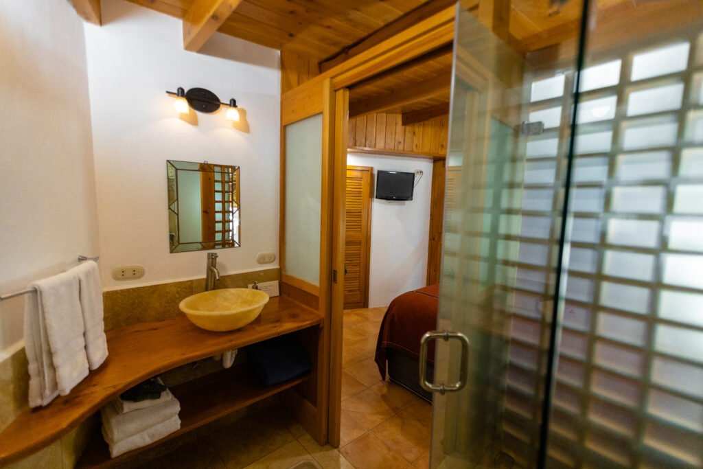 Villa Loft bathroom and bedroom: vanity, shower, bed