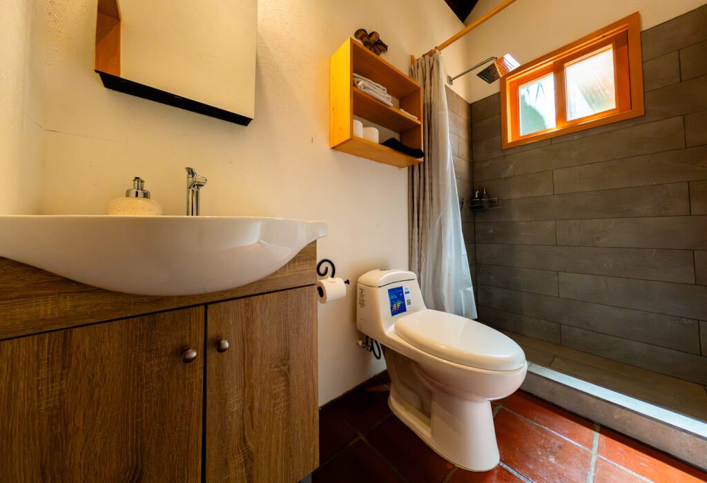 Villa Shakti bathroom with modern sink, toilet, and shower.