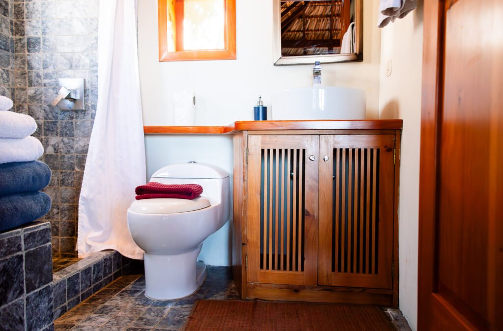 Bathroom at Villa Soluna with modern sink, toilet, and tiled shower.